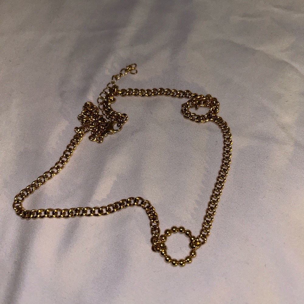 Gold necklace with connected circle pendant